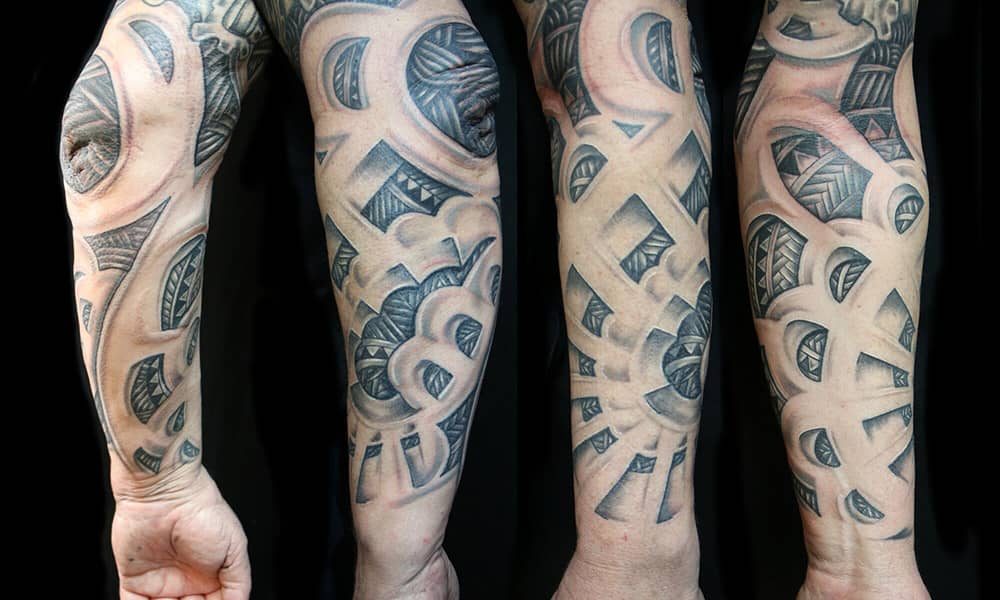 Arm sleeve tattoo split into 3 different areas down the arm. the first area  being Based