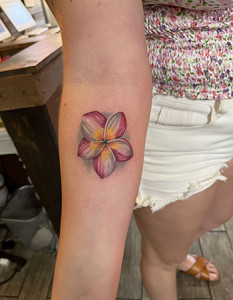 flower on forearm tattoo