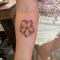 flower on forearm tattoo