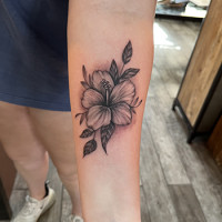 flowers on arm tattoo