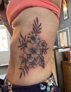 flowers on side tattoo